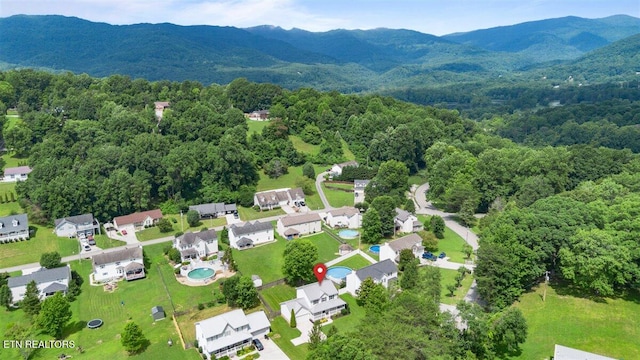 348 Ridge Rd, Caryville, TN 37714 - aerial perspective of suburban area featuring mountains