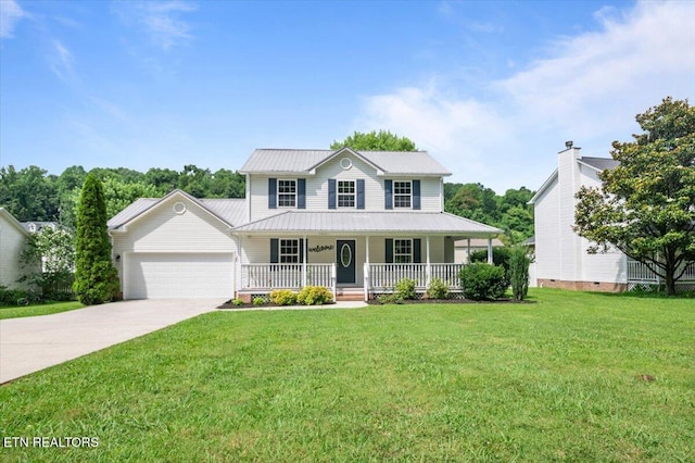 348 Ridge Rd, Caryville, TN 37714 - view of front of home with a porch, a garage, driveway, a front lawn, and a metal roof