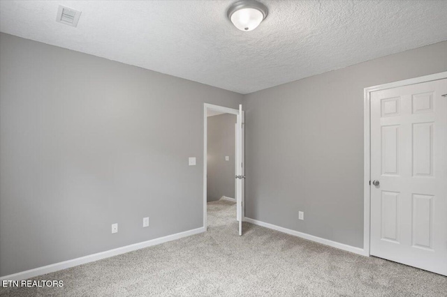 348 Ridge Rd, Caryville, TN 37714 - unfurnished bedroom featuring carpet flooring and a textured ceiling