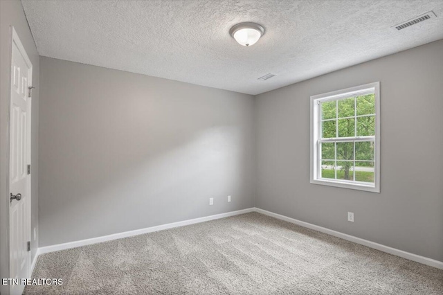 348 Ridge Rd, Caryville, TN 37714 - carpeted empty room with baseboards and a textured ceiling