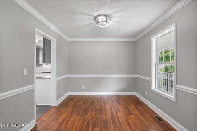 348 Ridge Rd, Caryville, TN 37714 - unfurnished room featuring dark wood-type flooring, a textured ceiling, and ornamental molding
