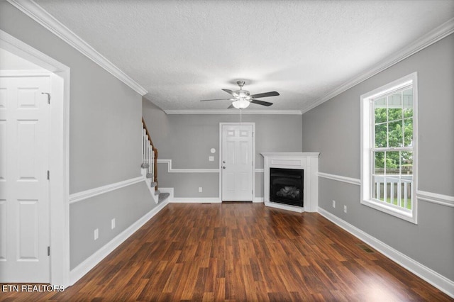 348 Ridge Rd, Caryville, TN 37714 - unfurnished living room featuring a textured ceiling, dark wood-style floors, stairs, ceiling fan, and a fireplace