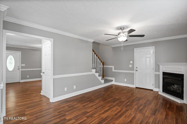 348 Ridge Rd, Caryville, TN 37714 - unfurnished living room featuring ceiling fan, wood finished floors, stairs, a textured ceiling, and a fireplace