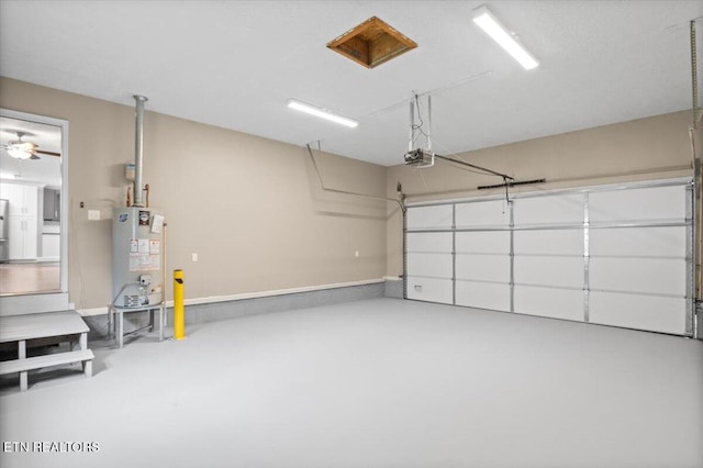 348 Ridge Rd, Caryville, TN 37714 - garage with water heater and a garage door opener