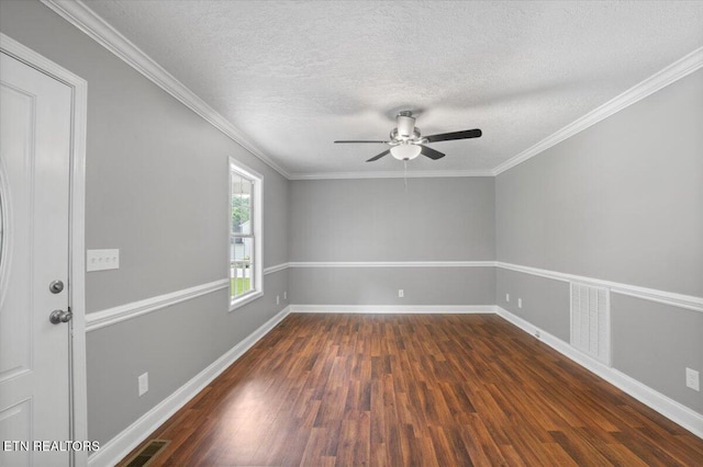 348 Ridge Rd, Caryville, TN 37714 - empty room featuring dark wood-style floors, a ceiling fan, a textured ceiling, and ornamental molding