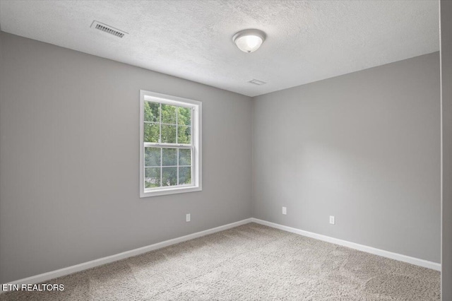 348 Ridge Rd, Caryville, TN 37714 - unfurnished room featuring a textured ceiling and carpet