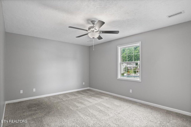 348 Ridge Rd, Caryville, TN 37714 - carpeted spare room with a ceiling fan and a textured ceiling