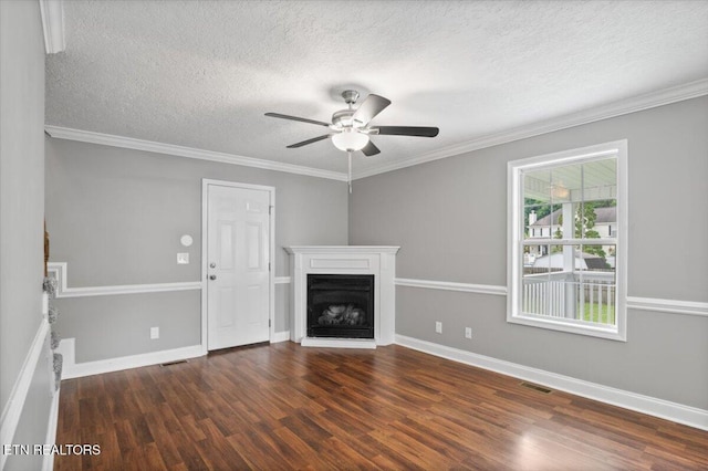348 Ridge Rd, Caryville, TN 37714 - unfurnished living room featuring wood finished floors, ceiling fan, a textured ceiling, a fireplace with raised hearth, and ornamental molding