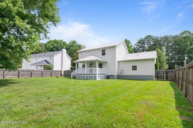 348 Ridge Rd, Caryville, TN 37714 - rear view of property featuring a fenced backyard, crawl space, and a ceiling fan