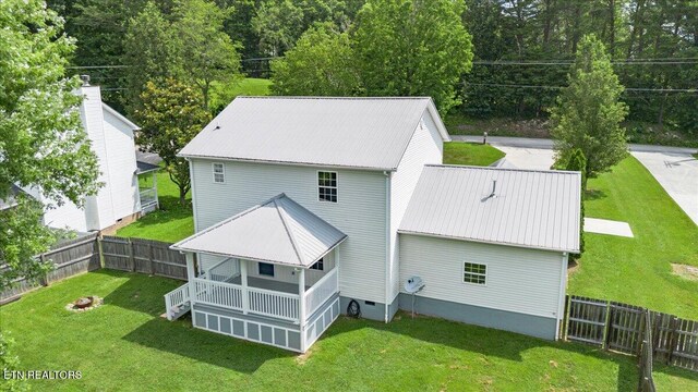 348 Ridge Rd, Caryville, TN 37714 - back of property featuring a metal roof, a fenced backyard, and a porch