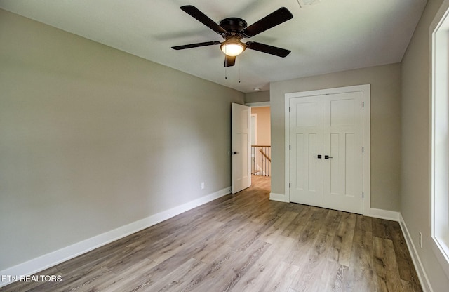 516 Golden Harvest Rd, Knoxville, TN 37934 - unfurnished bedroom with wood finished floors, a closet, and a ceiling fan