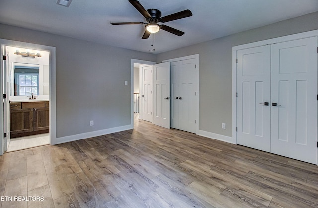 516 Golden Harvest Rd, Knoxville, TN 37934 - unfurnished bedroom with two closets, wood finished floors, connected bathroom, and ceiling fan