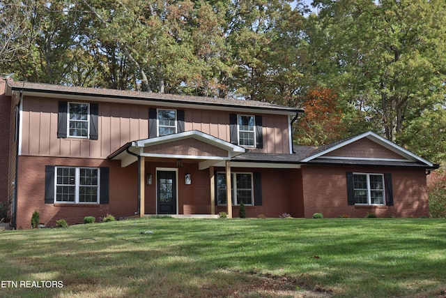 516 Golden Harvest Rd, Knoxville, TN 37934 - traditional-style home featuring board and batten siding, brick siding, and a front yard