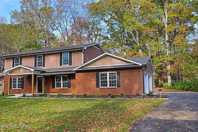 516 Golden Harvest Rd, Knoxville, TN 37934 - view of front of property featuring a front yard, asphalt driveway, and brick siding