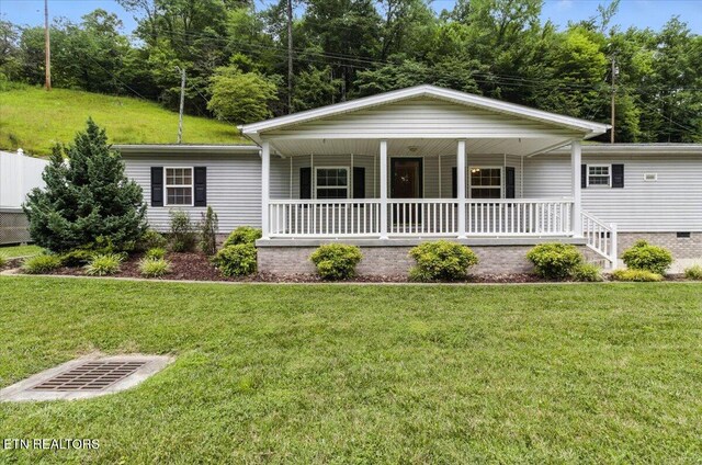 2953 US Highway 119, Pineville, KY 40977 - single story home featuring a porch, a front lawn, and crawl space