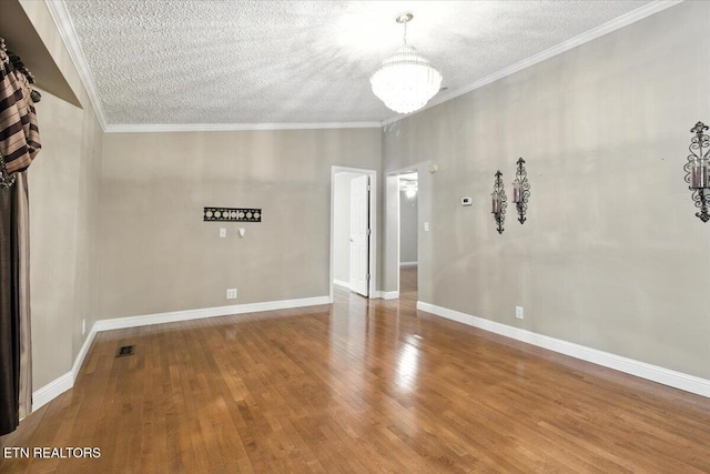 2953 US Highway 119, Pineville, KY 40977 - empty room with a chandelier, a textured ceiling, wood finished floors, and crown molding