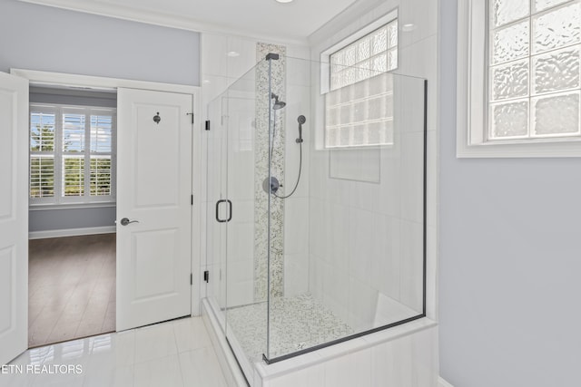 1273 Bishops View Ln, Knoxville, TN 37932 - full bathroom featuring a stall shower, tile patterned floors, and crown molding