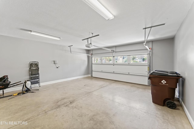 1273 Bishops View Ln, Knoxville, TN 37932 - garage featuring a garage door opener and baseboards