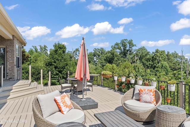 1273 Bishops View Ln, Knoxville, TN 37932 - wooden deck featuring outdoor dining area and view of scattered trees