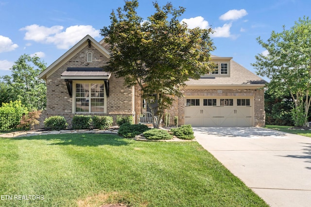 1273 Bishops View Ln, Knoxville, TN 37932 - view of front of property with brick siding, concrete driveway, and a front lawn