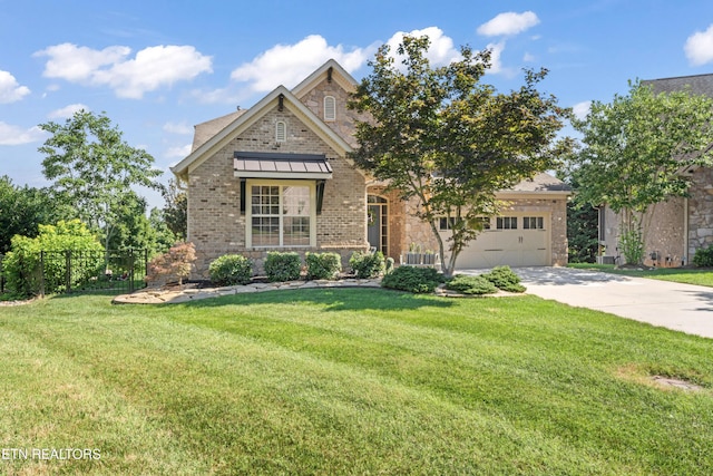 1273 Bishops View Ln, Knoxville, TN 37932 - view of front of house with driveway, brick siding, an attached garage, and stone siding