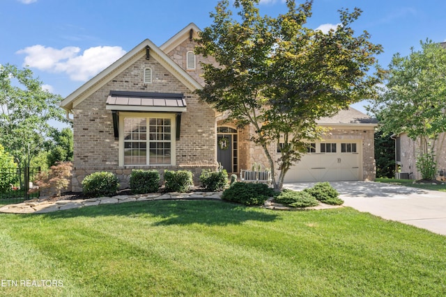 1273 Bishops View Ln, Knoxville, TN 37932 - view of front of house with concrete driveway, brick siding, a front yard, and a garage