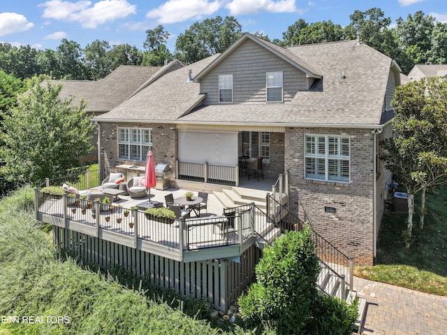 1273 Bishops View Ln, Knoxville, TN 37932 - rear view of house with outdoor dining space, brick siding, a shingled roof, and an outdoor hangout area