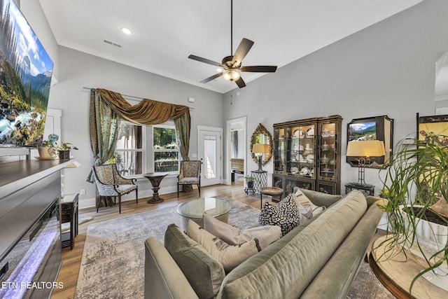 2570 NE Spring Creek Dr, Cleveland, TN 37311 - living room with a ceiling fan, wood finished floors, and a high ceiling