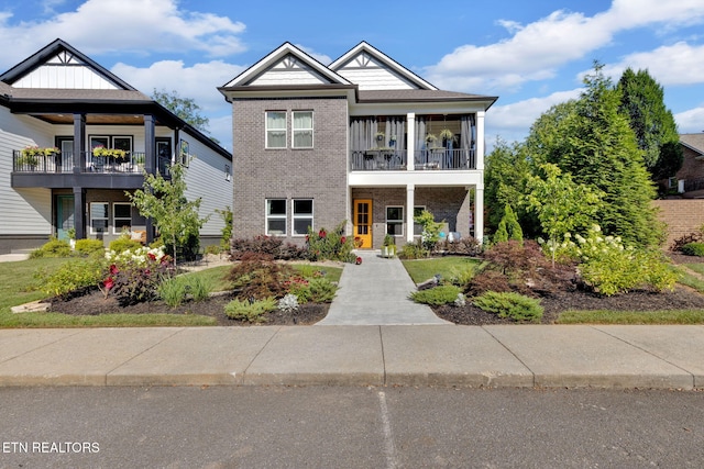 2570 NE Spring Creek Dr, Cleveland, TN 37311 - view of front of home with a balcony and brick siding