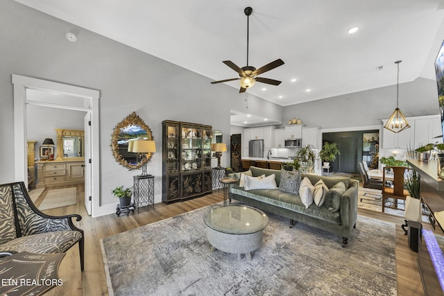 2570 NE Spring Creek Dr, Cleveland, TN 37311 - living room featuring a ceiling fan, light wood finished floors, and recessed lighting