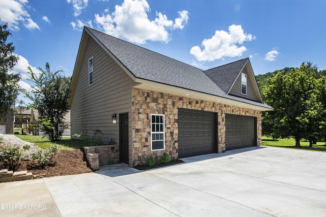 9436 Naff Rd, Heiskell, TN 37754 - view of property exterior featuring driveway, roof with shingles, and stone siding