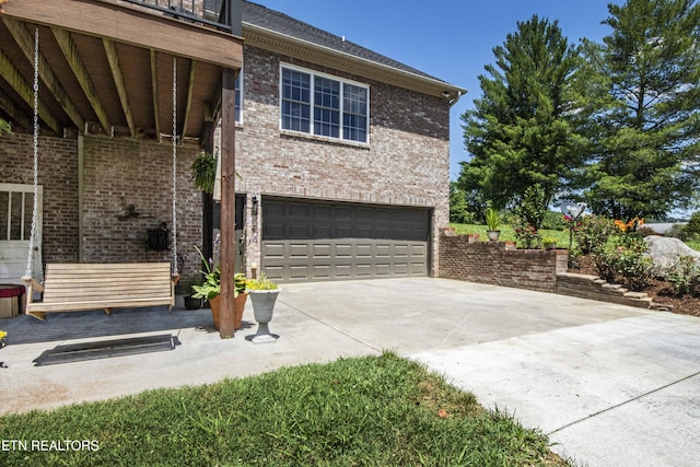 9436 Naff Rd, Heiskell, TN 37754 - view of front of property with an attached garage, brick siding, and driveway