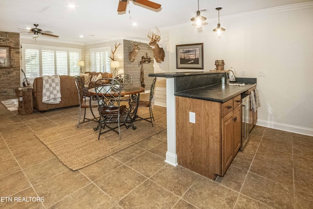 9436 Naff Rd, Heiskell, TN 37754 - kitchen with ceiling fan, brown cabinets, crown molding, dark countertops, and tile patterned floors