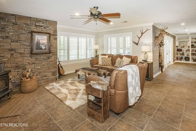 9436 Naff Rd, Heiskell, TN 37754 - tiled living area with ornamental molding, a ceiling fan, a wood stove, and recessed lighting