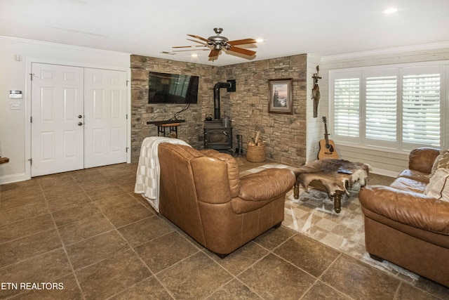 9436 Naff Rd, Heiskell, TN 37754 - living room featuring a wood stove, ornamental molding, ceiling fan, dark tile patterned flooring, and recessed lighting