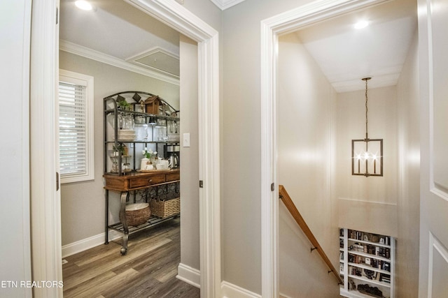 9436 Naff Rd, Heiskell, TN 37754 - hallway featuring an upstairs landing, attic access, crown molding, wood finished floors, and a chandelier