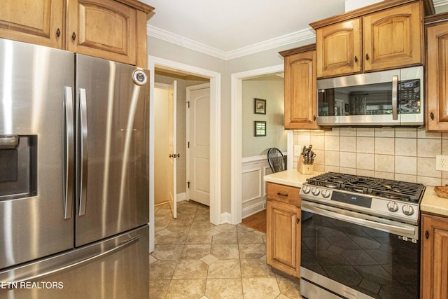 9436 Naff Rd, Heiskell, TN 37754 - kitchen with appliances with stainless steel finishes, ornamental molding, light countertops, brown cabinetry, and tasteful backsplash