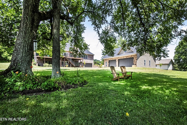 9436 Naff Rd, Heiskell, TN 37754 - view of grassy yard with a garage and stairway