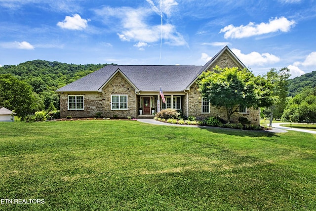 9436 Naff Rd, Heiskell, TN 37754 - ranch-style house featuring a front yard, a shingled roof, stone siding, and brick siding