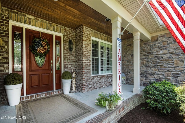 9436 Naff Rd, Heiskell, TN 37754 - doorway to property with covered porch and brick siding