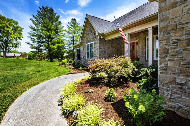 9436 Naff Rd, Heiskell, TN 37754 - view of home's exterior with stone siding, a lawn, and a shingled roof