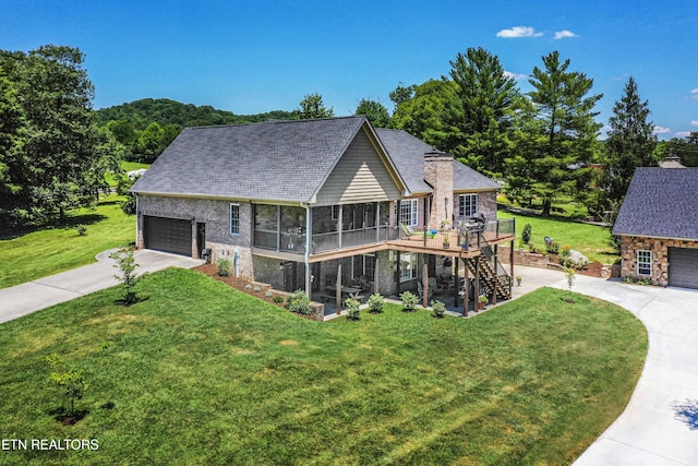9436 Naff Rd, Heiskell, TN 37754 - view of front facade with stairway, concrete driveway, a deck, a sunroom, and a front yard
