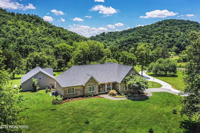 9436 Naff Rd, Heiskell, TN 37754 - view of front of home with a wooded view, a front lawn, and stone siding