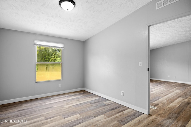 1768 Fain Cemetery Rd, Dandridge, TN 37725 - unfurnished room with a textured ceiling and wood finished floors
