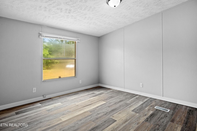 1768 Fain Cemetery Rd, Dandridge, TN 37725 - empty room with wood finished floors and a textured ceiling