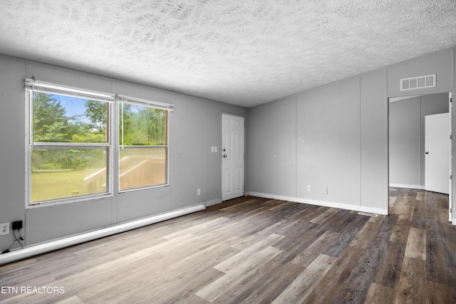 1768 Fain Cemetery Rd, Dandridge, TN 37725 - spare room featuring wood finished floors, a textured ceiling, and baseboard heating