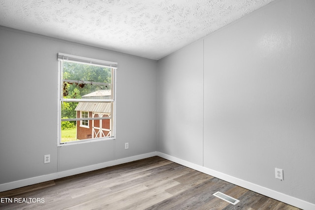 1768 Fain Cemetery Rd, Dandridge, TN 37725 - empty room featuring wood finished floors and a textured ceiling
