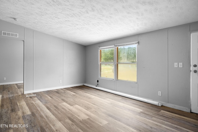 1768 Fain Cemetery Rd, Dandridge, TN 37725 - empty room featuring wood finished floors and a textured ceiling