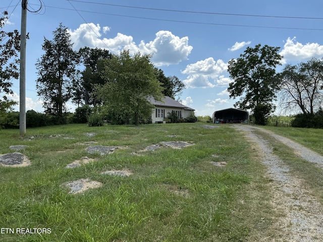 1890 Doaks Creek Rd, Speedwell, TN 37870 - view of yard with a carport and dirt driveway