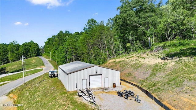 2270 Cove Pointe Rd, Lafollette, TN 37766 - view of pole building featuring gravel driveway and a forest view